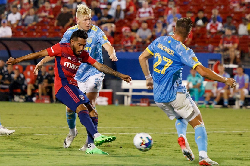 FC Dallas forward Jesús Ferreira (10) shoots the ball for a goal between Philadelphia Union...