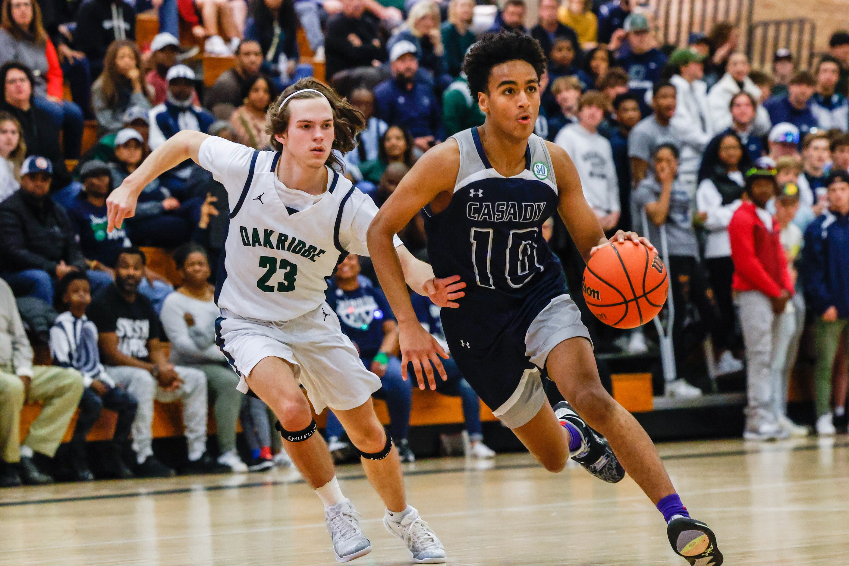 Oakridge Owls' Evan Childress (23) tries to recover the ball from Casady Cyclones' Payton...