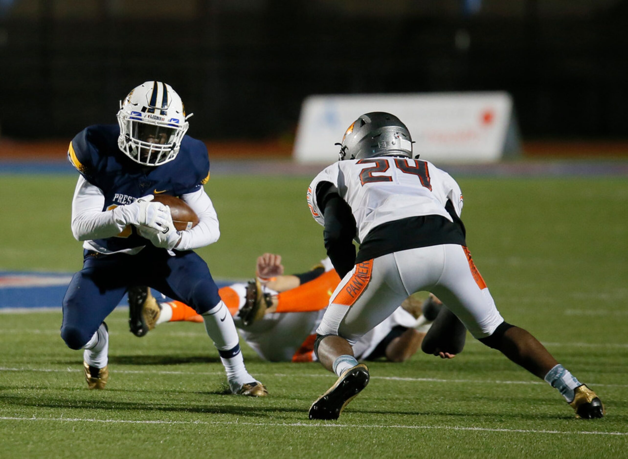 Prestonwood Christian Academy Timothy Taylor (33) is tackled by St. Pius X High School...