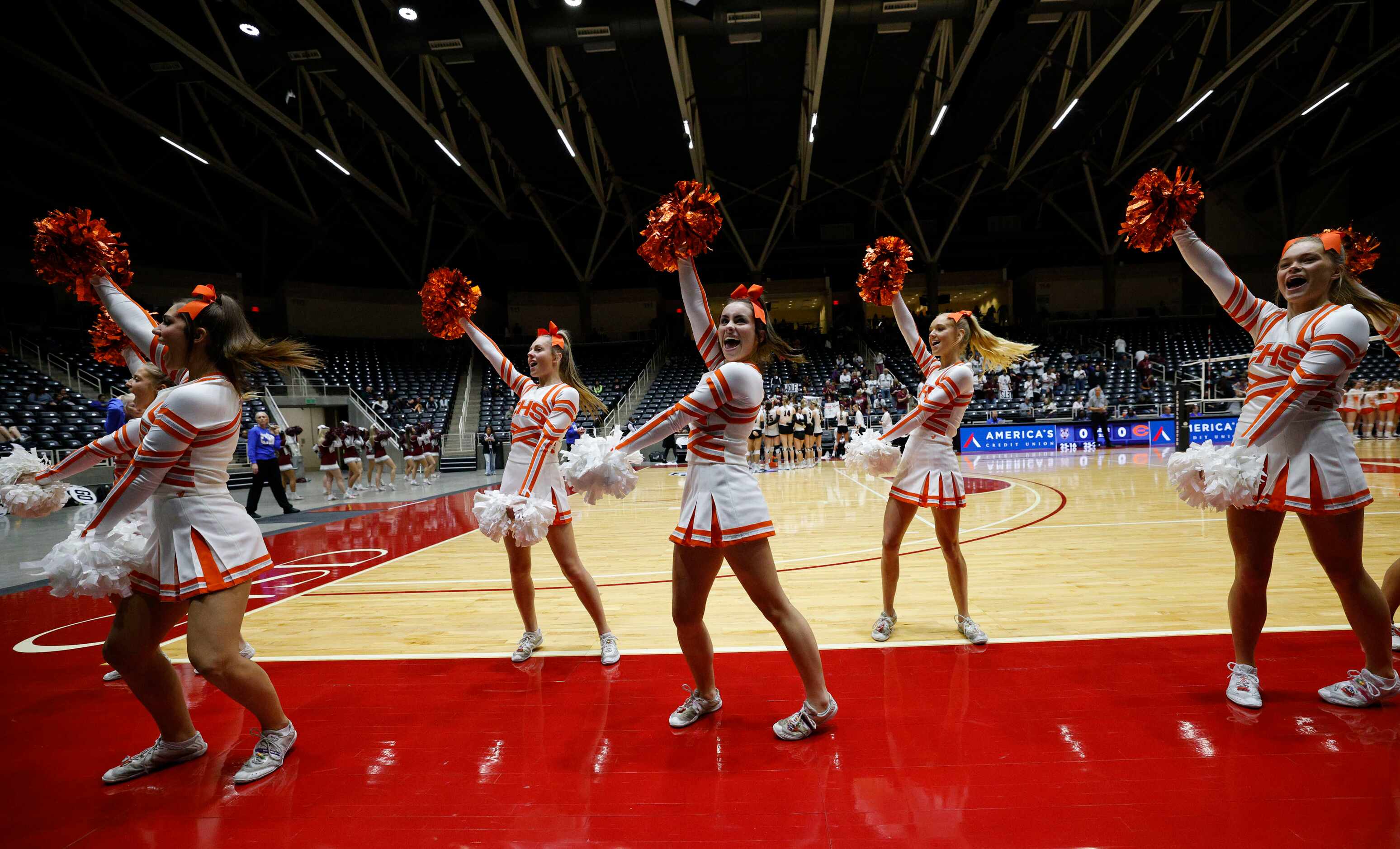 Celina cheerleaders perform during a UIL class 4A volleyball state semifinal against Comal...