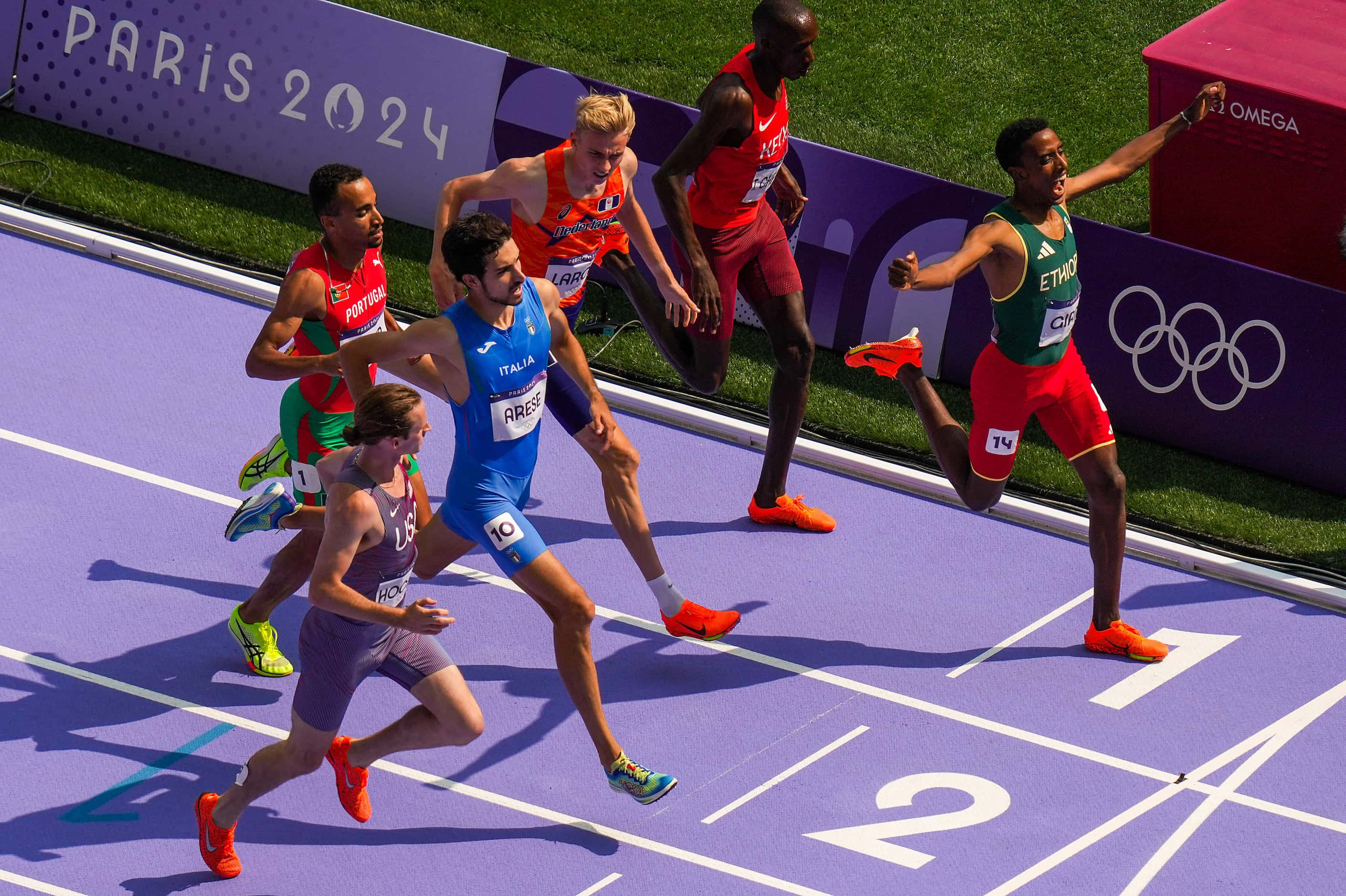 Ermias Girma of Ethiopia (right) celebrates winning a heat of the men’s 1500-meters at the...