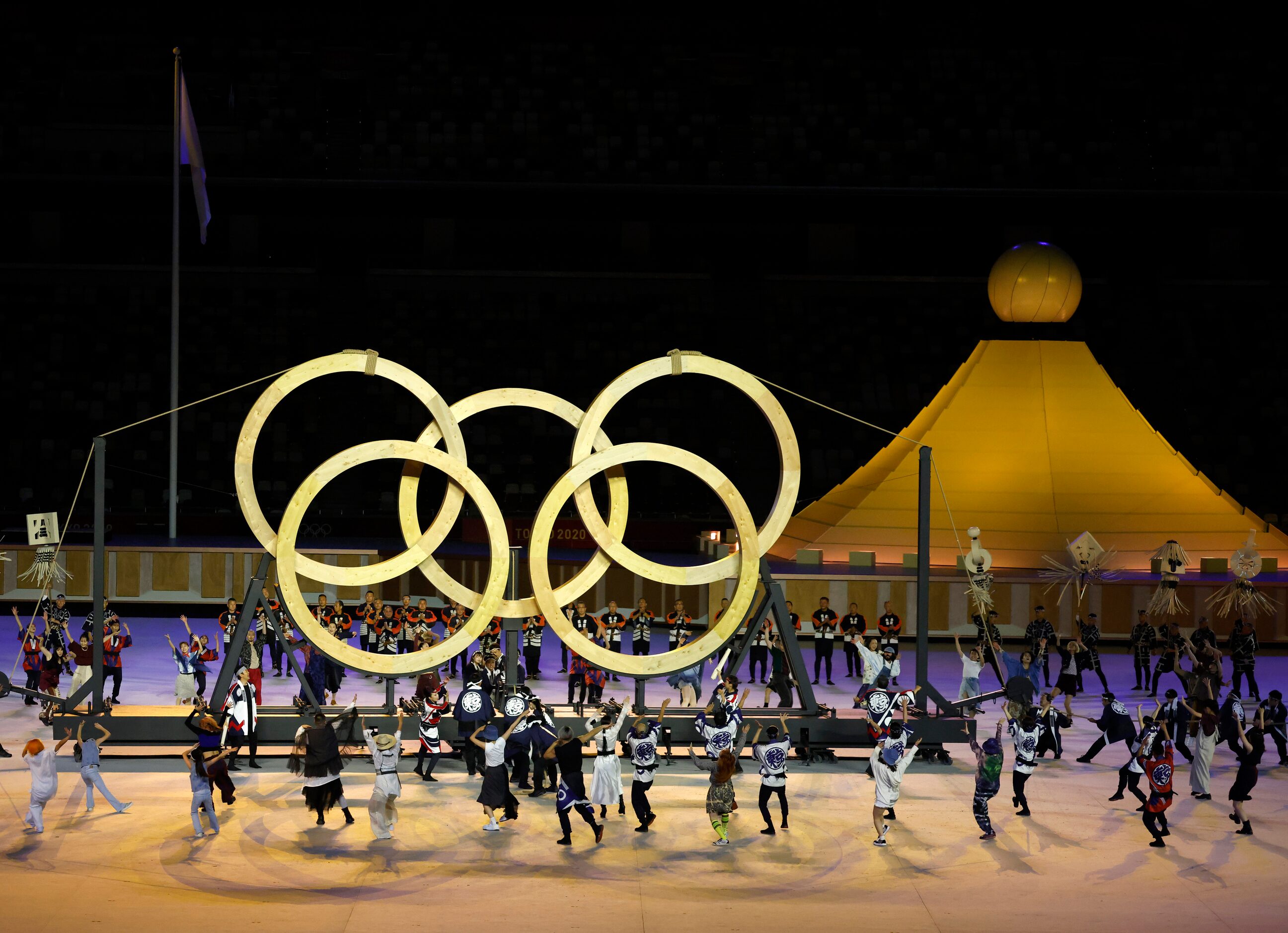 Entertainers perform during the opening ceremony for the postponed 2020 Tokyo Olympics at...