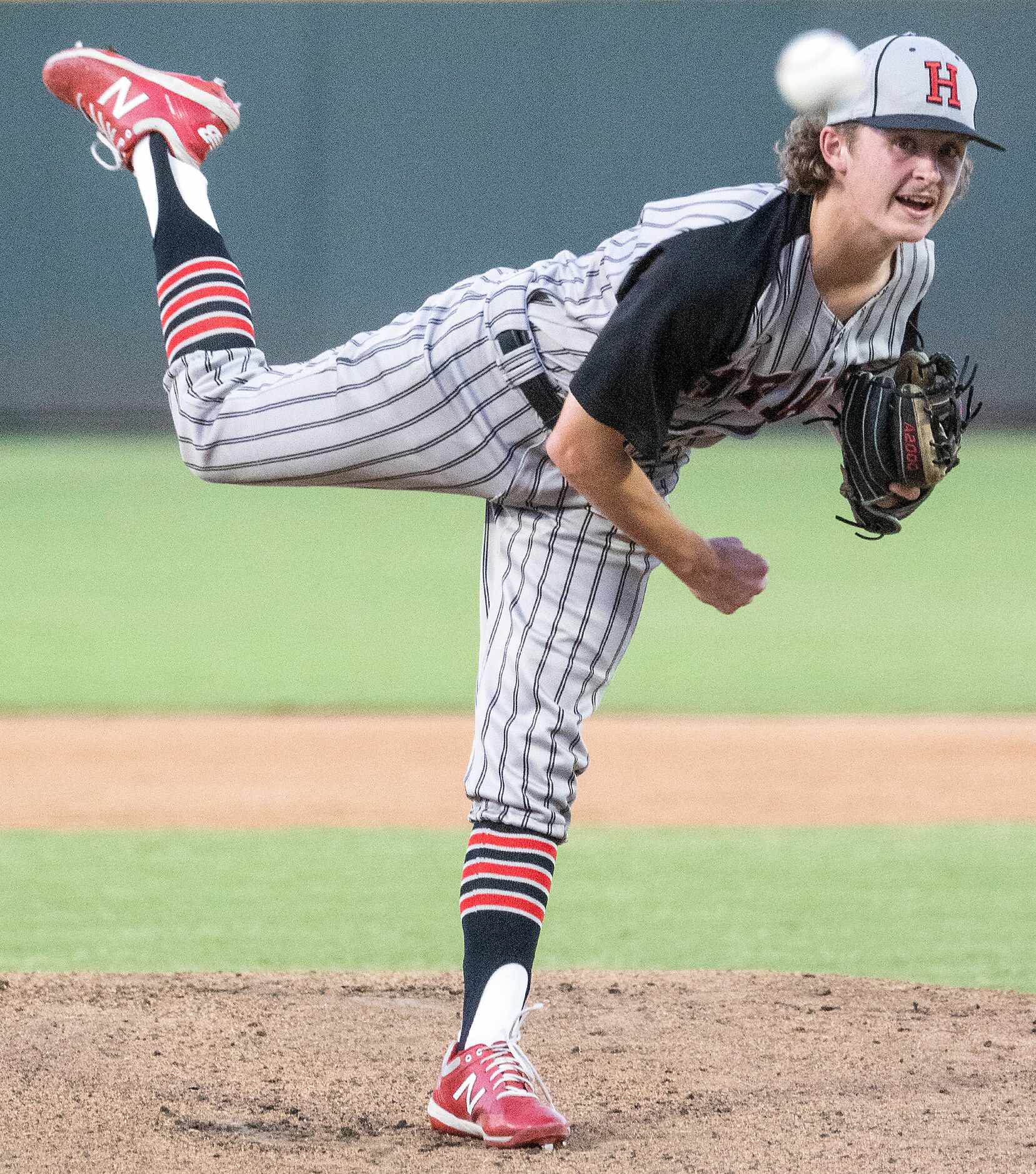 Rockwell-Heath Baylor Baumann, (1), pitches against Comal Smithson Valley during the first...