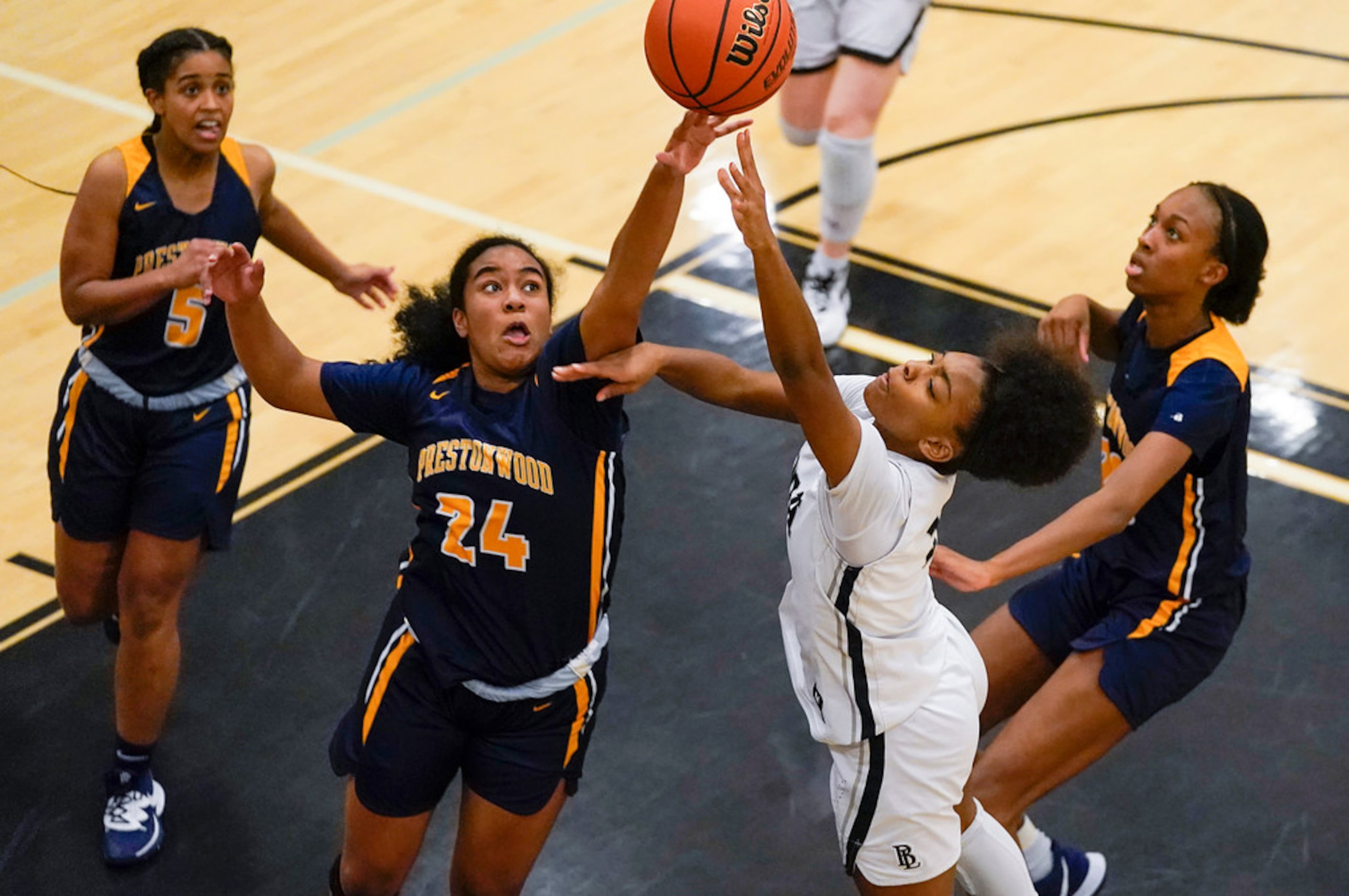 Prestonwood Christian forward Bria Stephens (24) blocks a shot by Bishop Lynch guard Maddie...