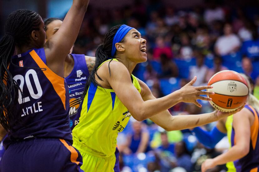 Dallas Wings guard Allisha Gray (15) looks for a shot during the first quarter of a WNBA...