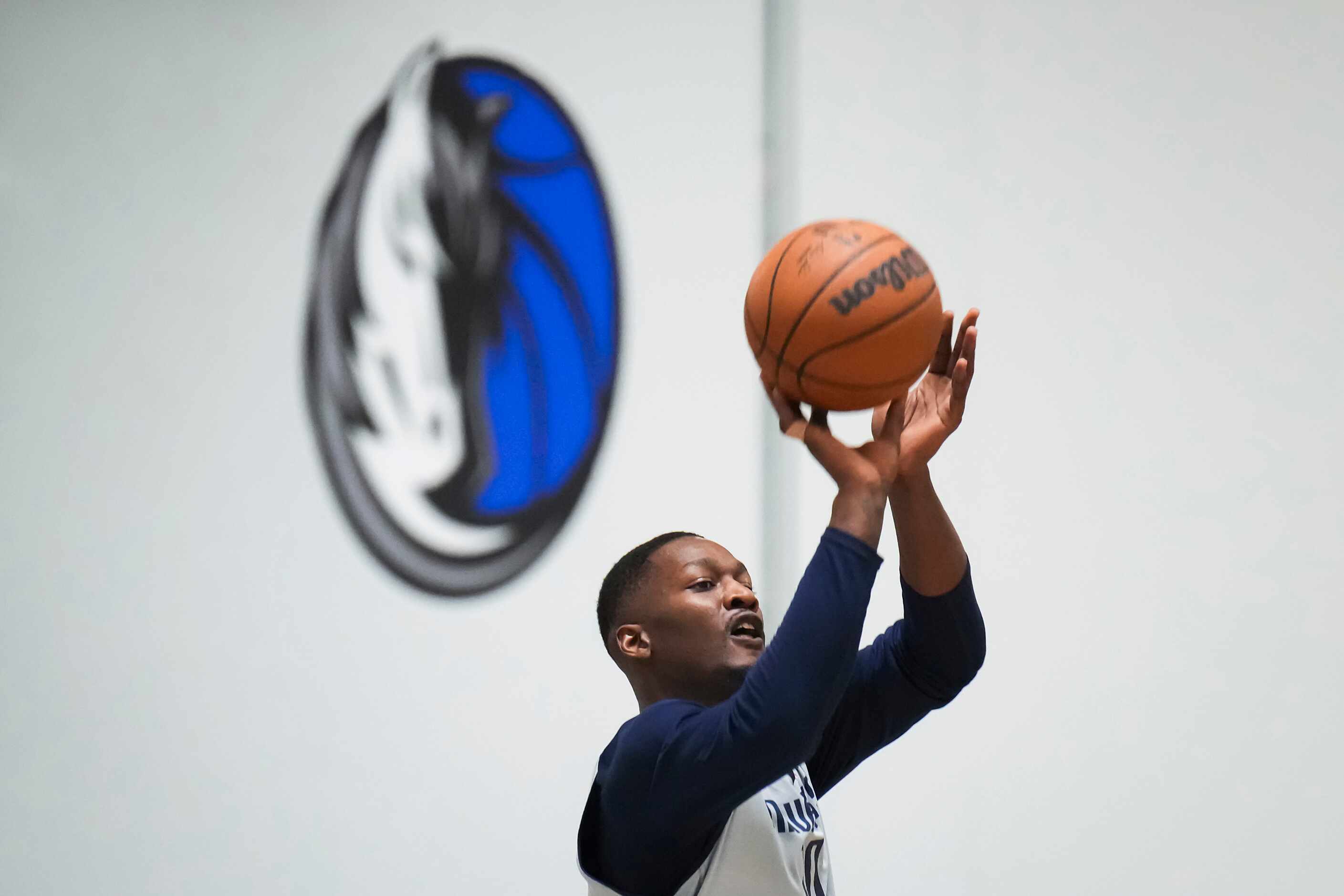Dallas Mavericks forward Dorian Finney-Smith shoots as the team practices in preparation for...