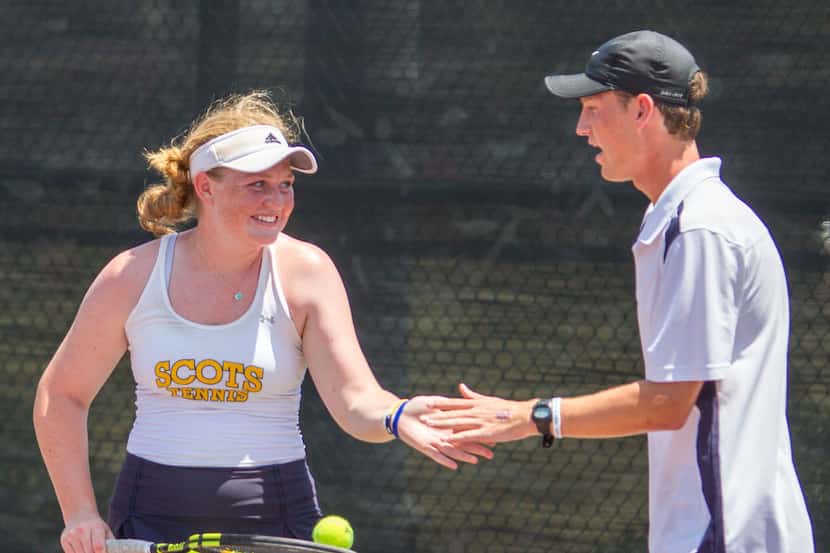 Highland Park's Katherine Petty and Phillip Quinn high-five after a play in a double match...