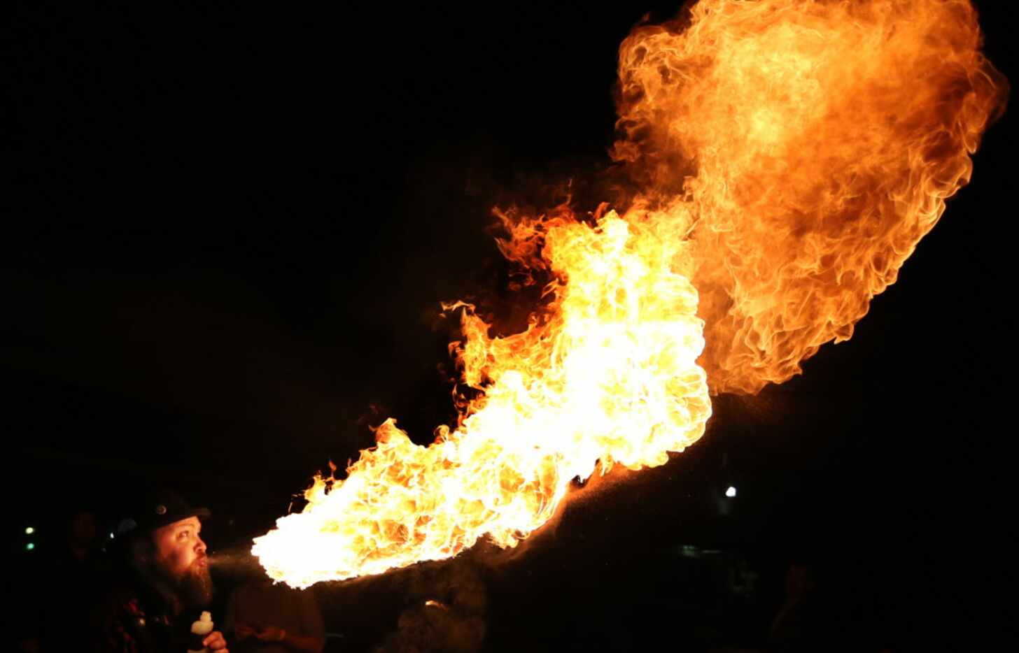 Fire breather Charlie Tips, cq, performs at Henry's Majestic , during the Trigger's Toys...