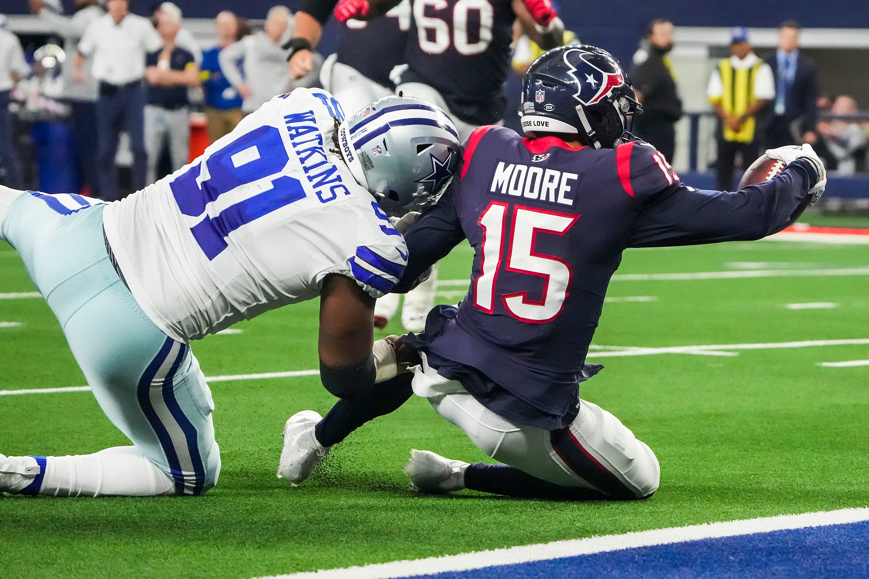 Houston Texans wide receiver Chris Moore (15) is stopped short of the end zone by Dallas...