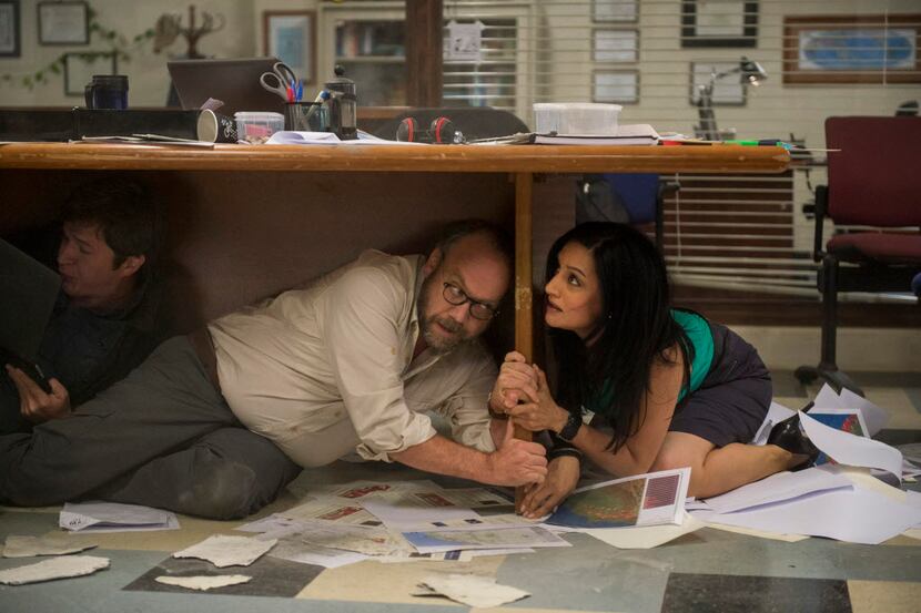 This photo provided by Warner Bros. Pictures shows Paul Giamatti as Lawrence and Archie...