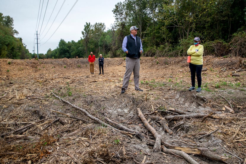 Master naturalist Ben Sandifer (center) and City Council member Paula Blackmon (right)...