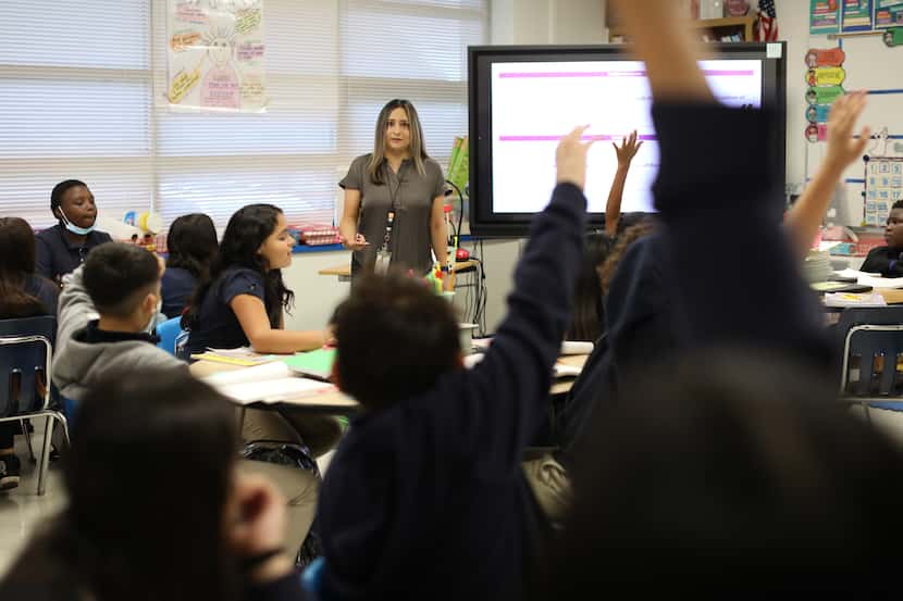 Adrienne Martinez teaches students using a new reading curriculum at Anson Jones Elementary...