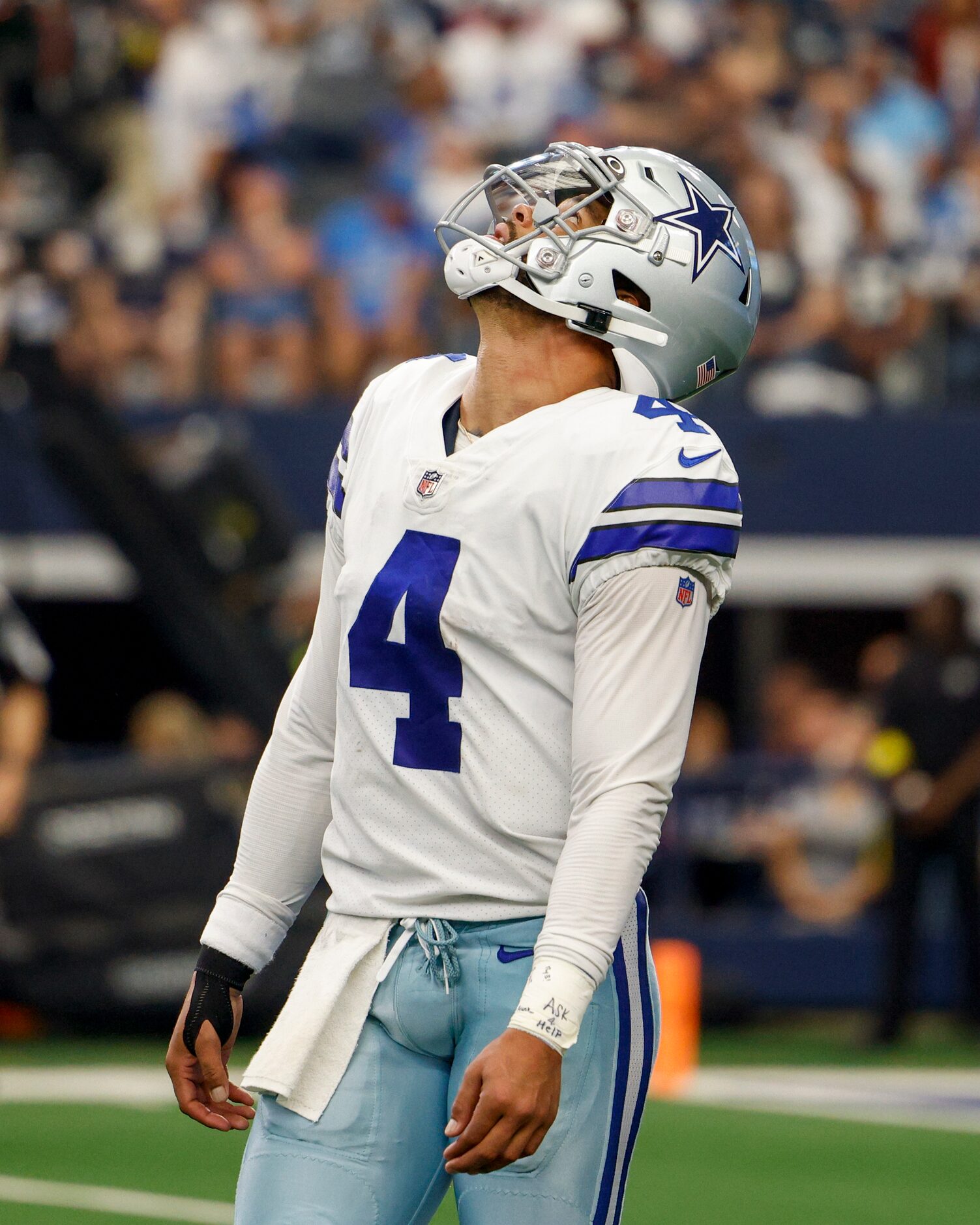 Dallas Cowboys quarterback Dak Prescott (4) watches a replay after a fumble by wide receiver...