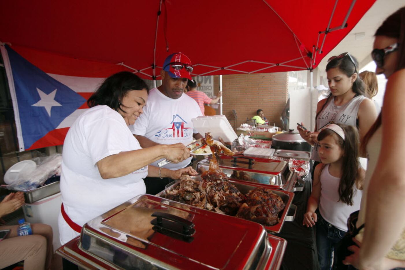 Bernice Castro (left) and her husband, Ismael Castro, served traditional Puerto Rican-style...