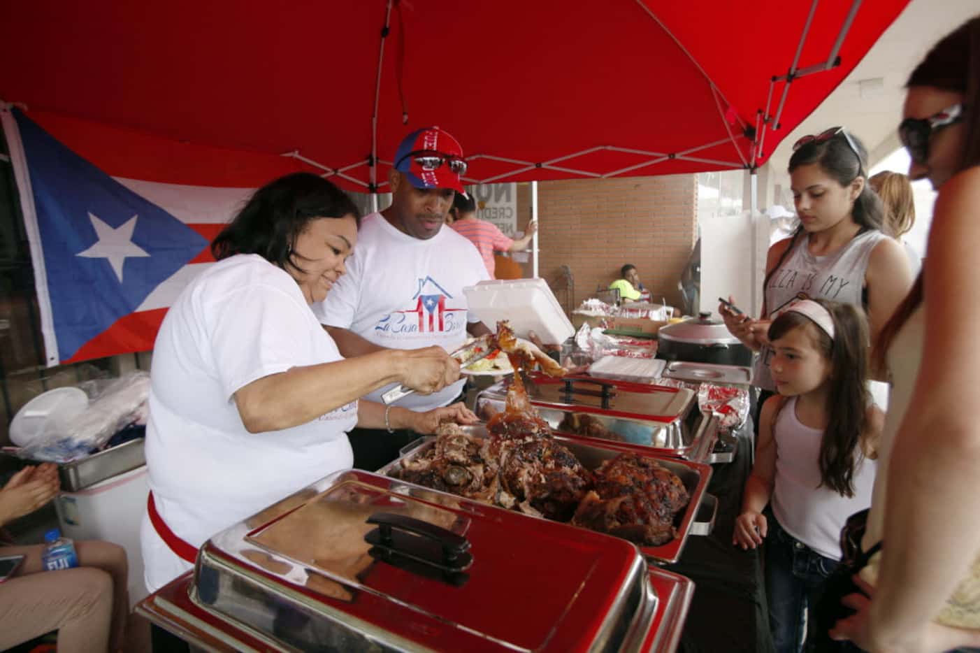 Bernice Castro (left) and her husband, Ismael Castro, served traditional Puerto Rican-style...