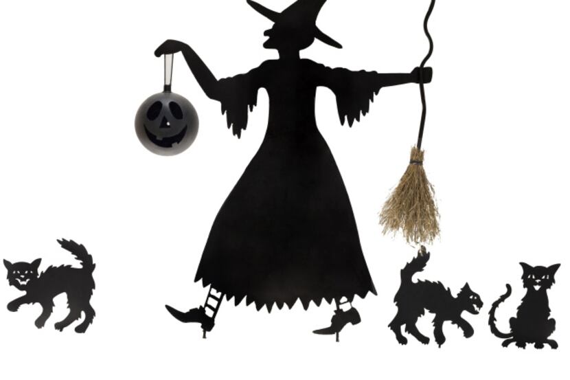 A witch with her catty companions, metal silhouettes for the front yard, is $149.99 from...