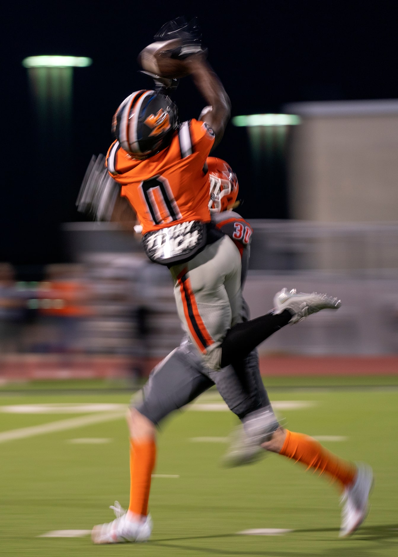 Lancaster junior wide receiver Ti’Erick Martin (0) makes a catch in front of senior...