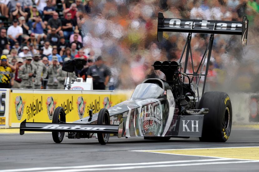 In this photo provided by NHRA, Shawn Langdon secures the No. 1 qualifying position in his...