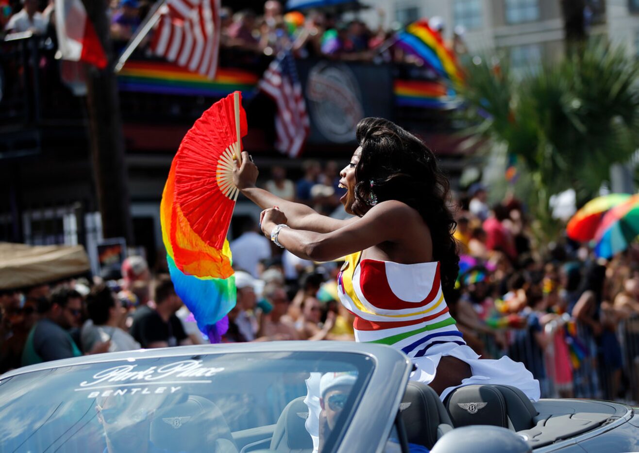 Grand Marshall Nicole O'Hara Munro yells and blows kisses to folks in the crowd during the...