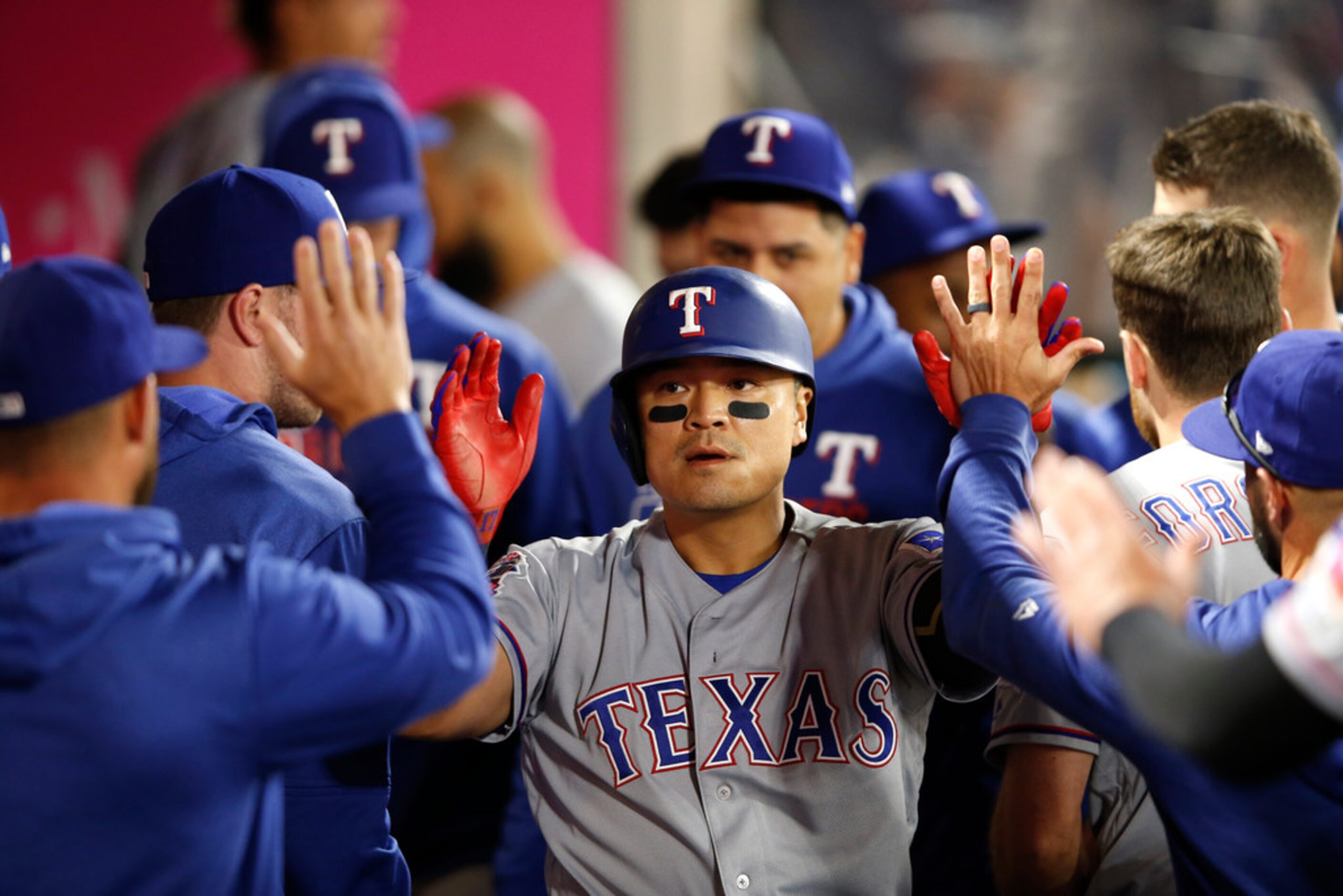 ANAHEIM, CALIFORNIA - MAY 24:  Shin-Soo Choo #17  is congratulated in the dugout after...