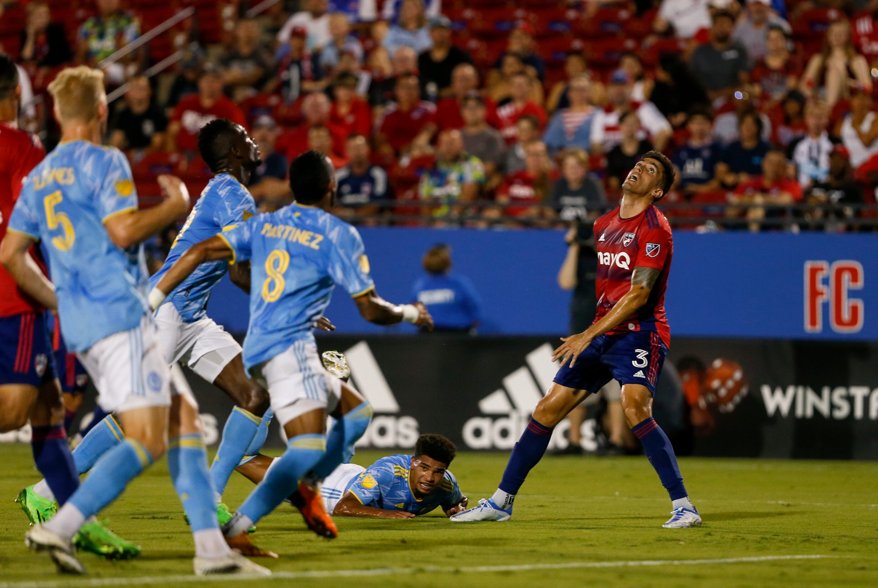 FC Dallas defender José Antonio Martínez (3) prepares to head the ball during the first half...