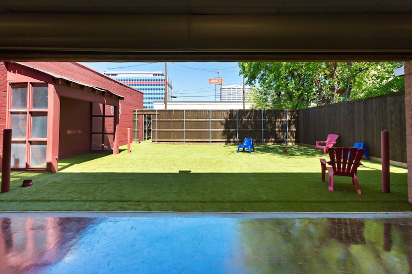 You can check out the playroom yard at Barking Hound Village during a yappy hour Thursday.