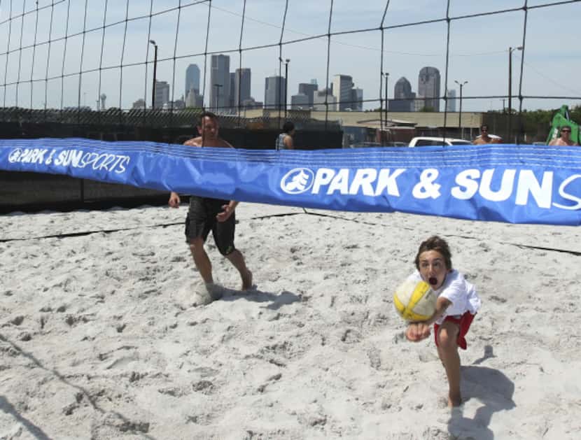 Kade Bontrager,13, makes a diving save whle playing volleyball at the soon to open Sandbar...
