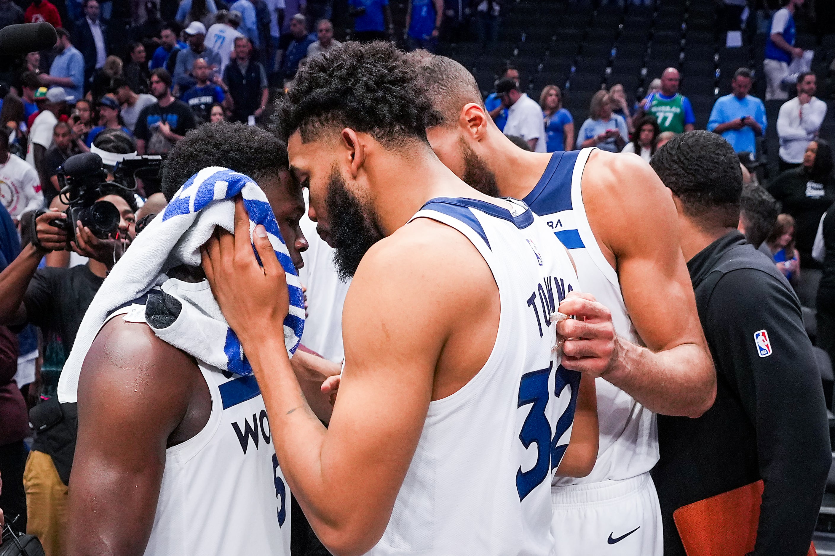 Minnesota Timberwolves guard Anthony Edwards (5) celebrates with center Karl-Anthony Towns...