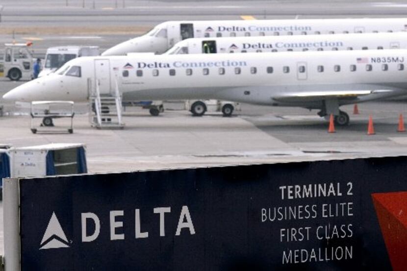 Delta Connection regional jets are parked on the tarmac at John F. Kennedy Airport in New...