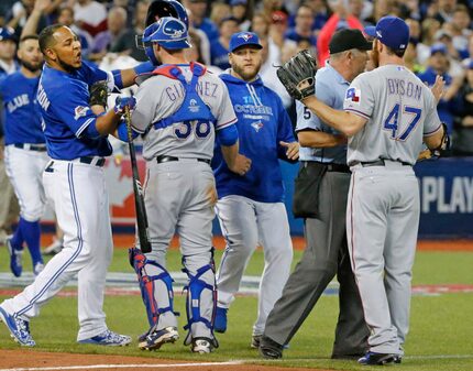 Toronto Blue Jays designated hitter Edwin Encarnacion, left, and Texas Rangers relief...