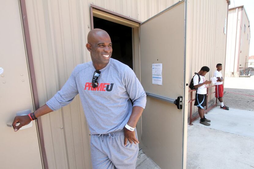 Football Hall of Famer Deion Sanders was all smiles moments after concluding a meeting with...