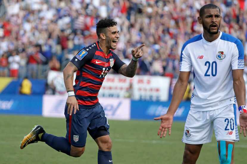 United States' Dom Dwyer (14) celebrates after scoring a goal as Panama's Anibal Godoy (20)...