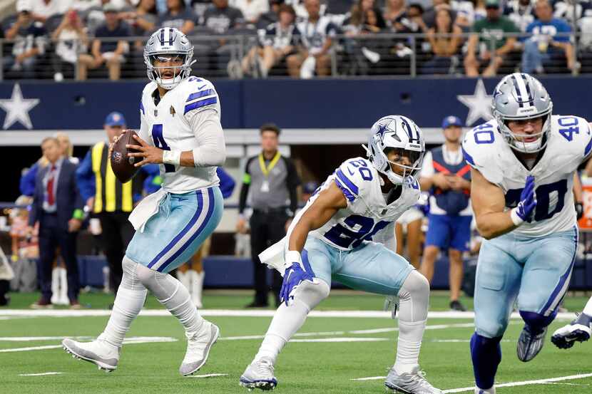 Dallas Cowboys quarterback Dak Prescott (4) drops back in the red zone looking for a...