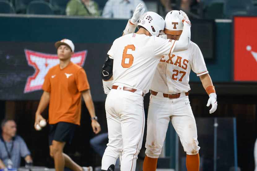 Texas catcher Rylan Galvan (6) and infielder Jack O'Dowd (27) cheers after a homer by O'Dowd...