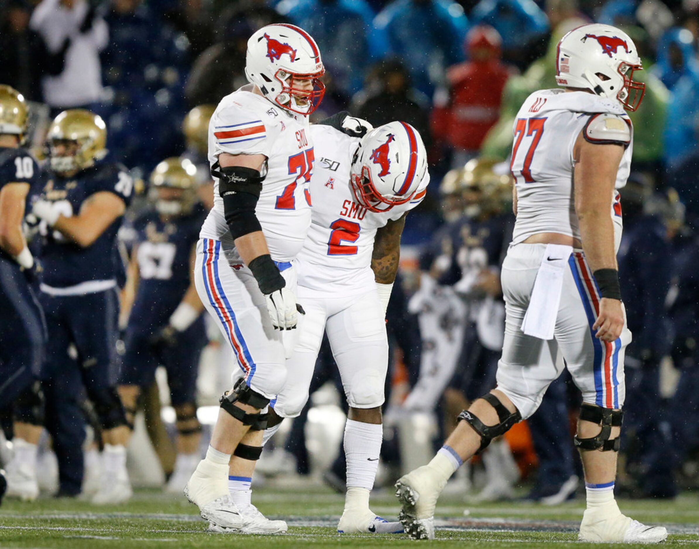 Southern Methodist Mustangs offensive lineman Hayden Howerton (75) consoles running back...