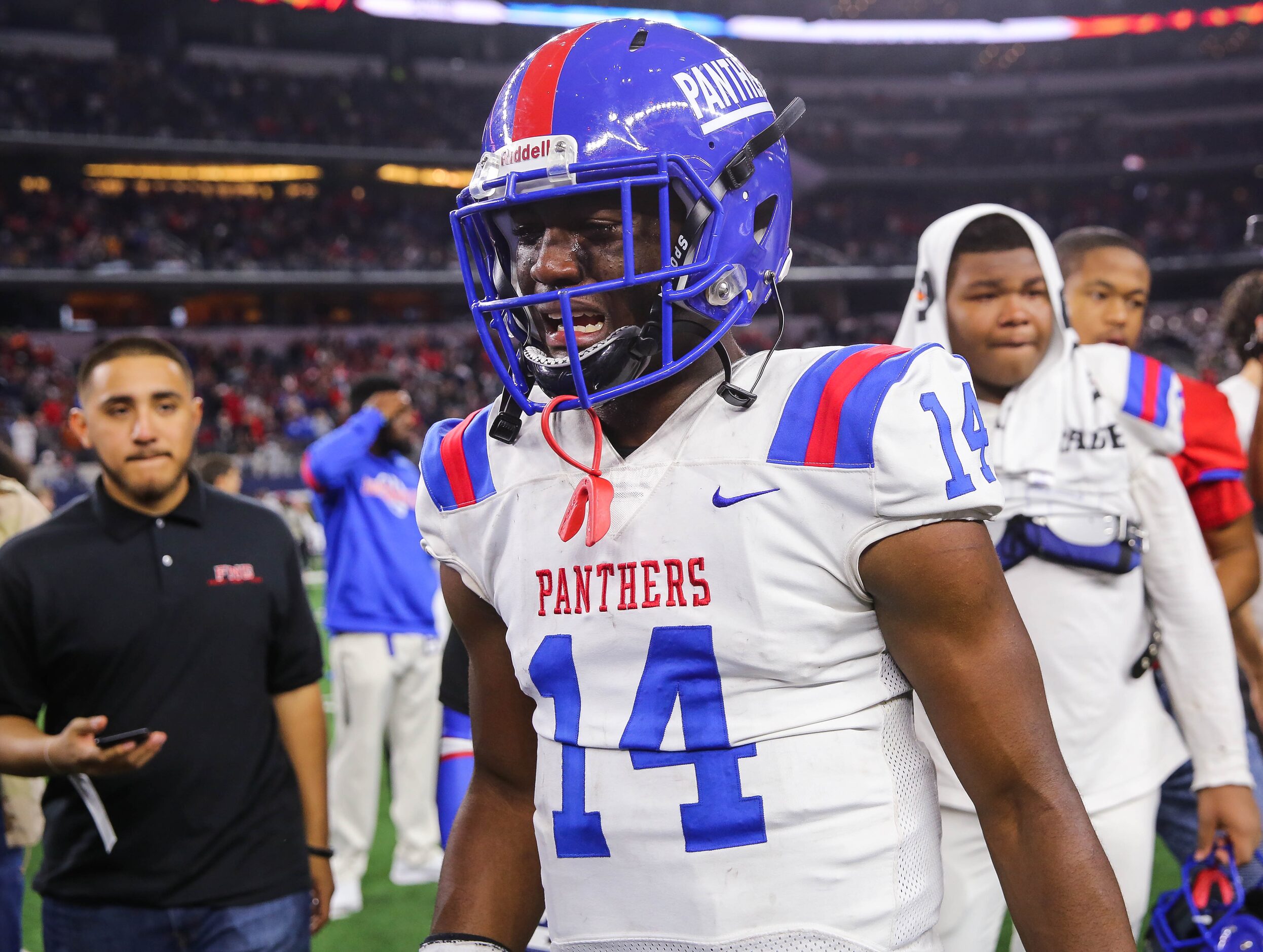 Duncanville's quarterback Chris Parson (14) is emotional after losing a Class 6A Division I...