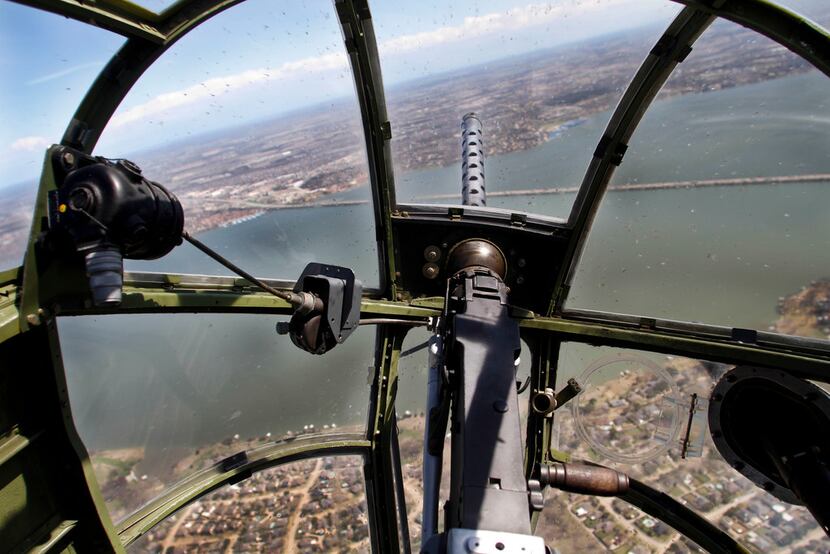 The view looking over a .30-caliber machine gun from the bombardier/navigator seat in the...