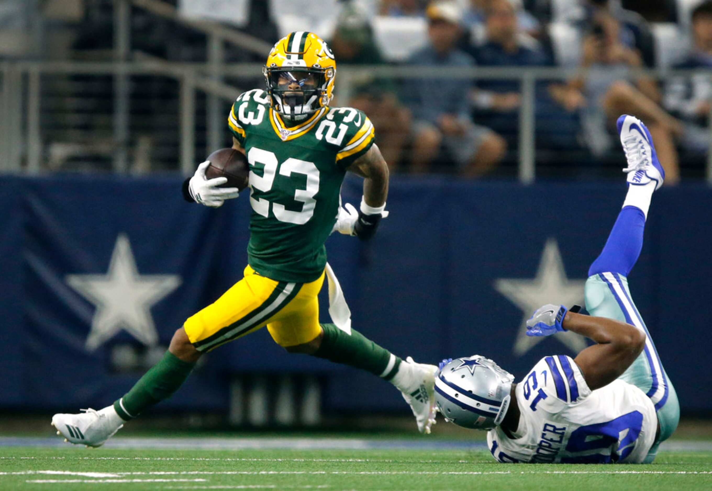 Green Bay Packers cornerback Jaire Alexander (23) intercepts a pass thrown by Dallas Cowboys...