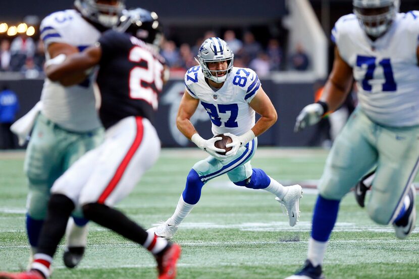 Dallas Cowboys tight end Geoff Swaim (87) receives some blocking after making a first...