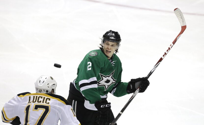 Dallas Stars defenseman Jyrki Jokipakka (2) and Boston Bruins left wing Milan Lucic (17)...