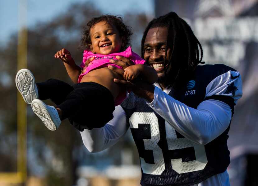 Dallas Cowboys free safety Kavon Frazier (35) plays with his daughter, Kali Frazier, 15...
