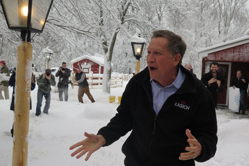  Ohio Gov. John Kasich, in the midst of a snowball fight after his 99th New Hampshire town...