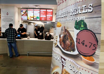 Walmart toy department manager Joshua Houston orders lunch from Gilbert Juarez at the first...