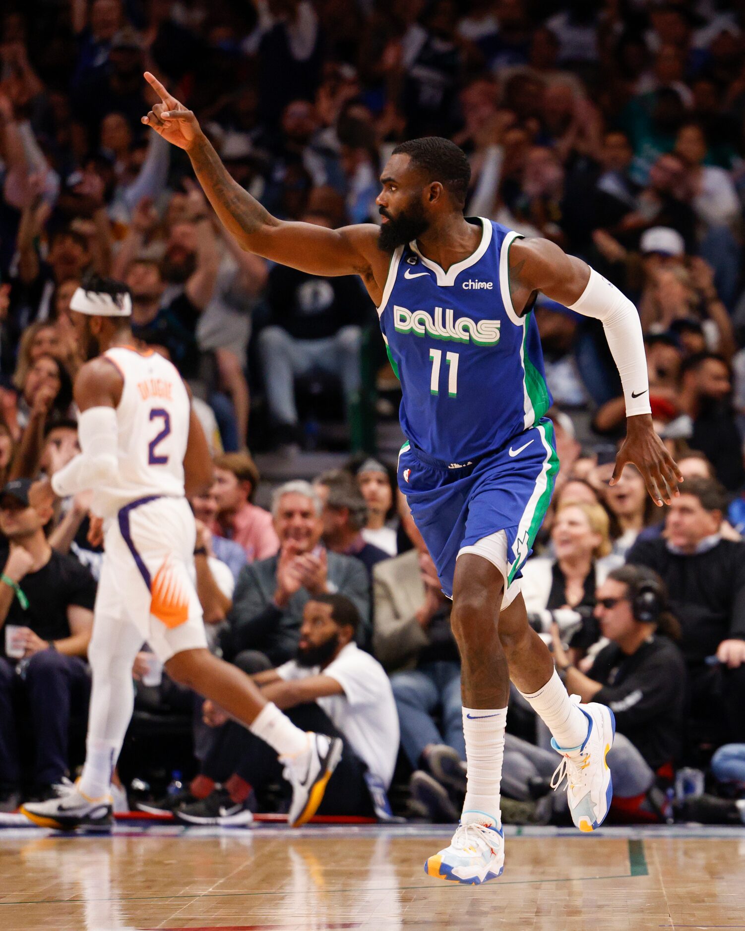 Dallas Mavericks forward Tim Hardaway Jr. (11) celebrates a three-point shot during the...