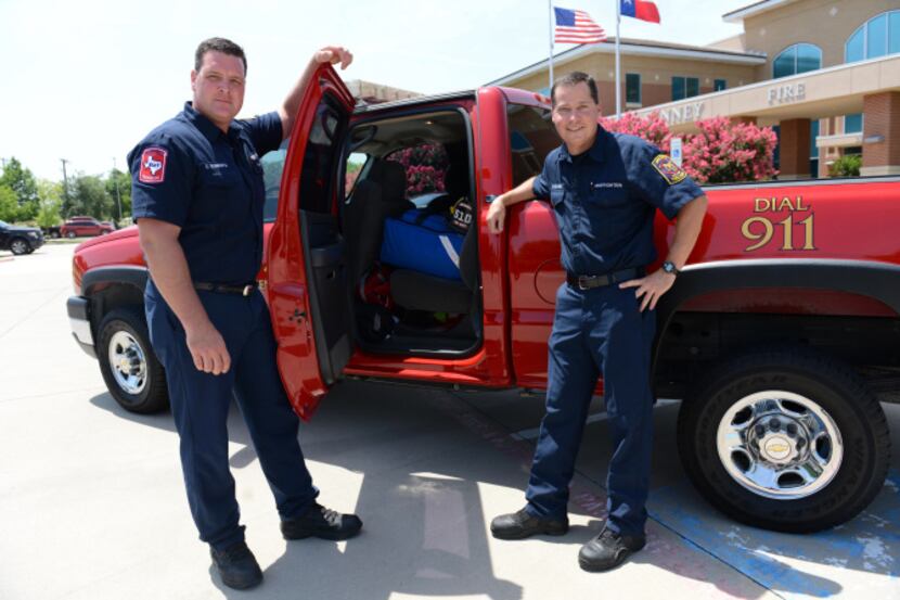 The bright red truck is used by McKinney firefighter/paramedics Chris Roberts (left) and...