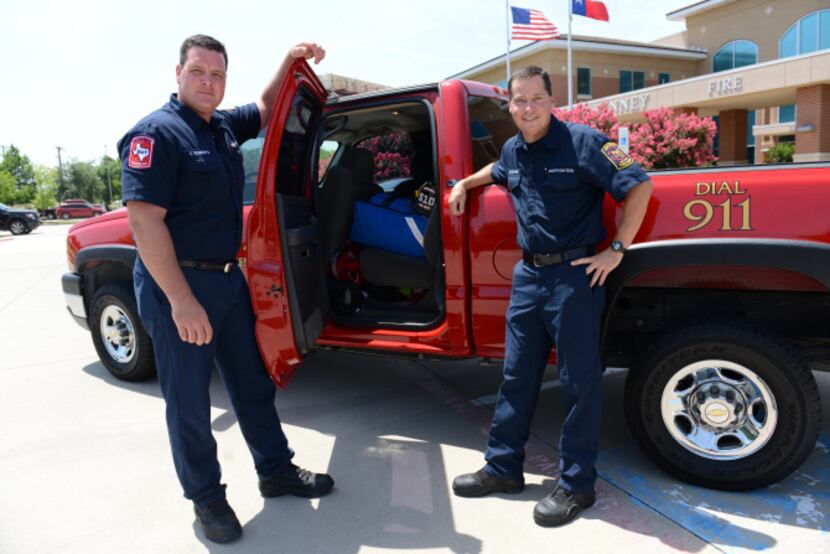 The bright red truck is used by McKinney firefighter/paramedics Chris Roberts (left) and...