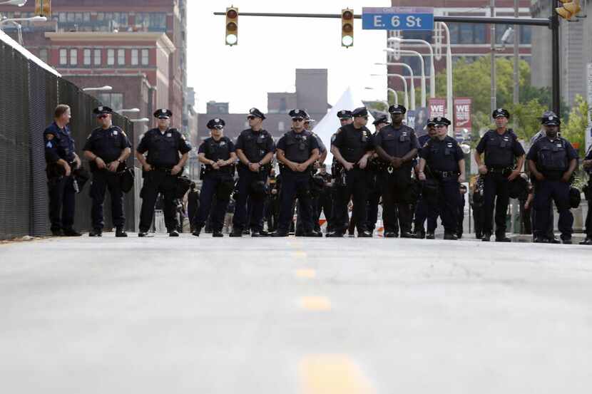 Cleveland Police blocked a street to force protesters down a road Sunday before the start of...