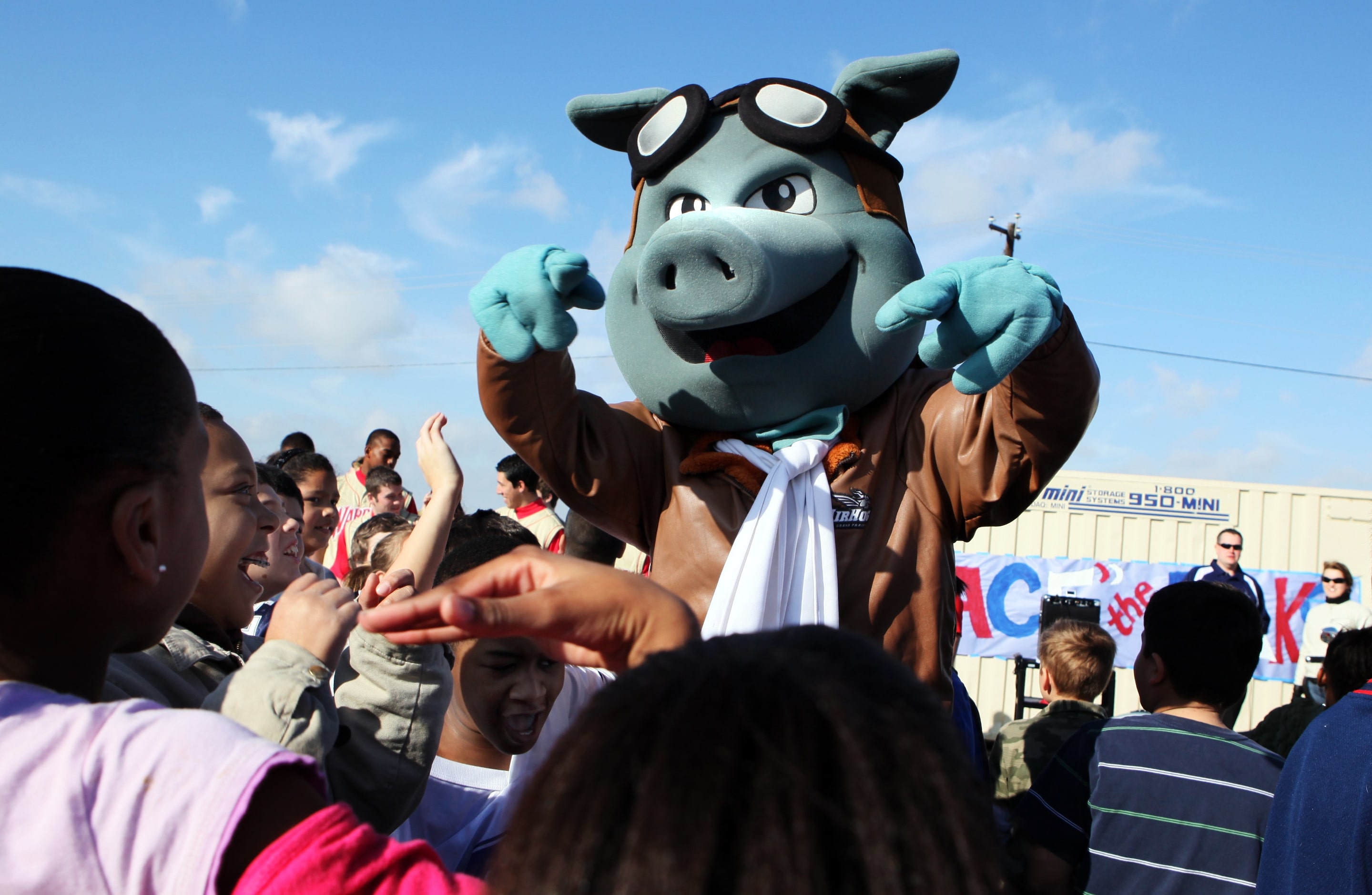 Ace Bacon, the AirHogs mascot, cheers students at the John Nance Garner Elementary School...