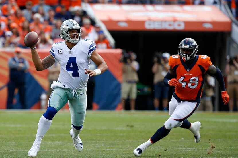 Dallas Cowboys quarterback Dak Prescott (4) throws in the first quarter at Sports Authority...