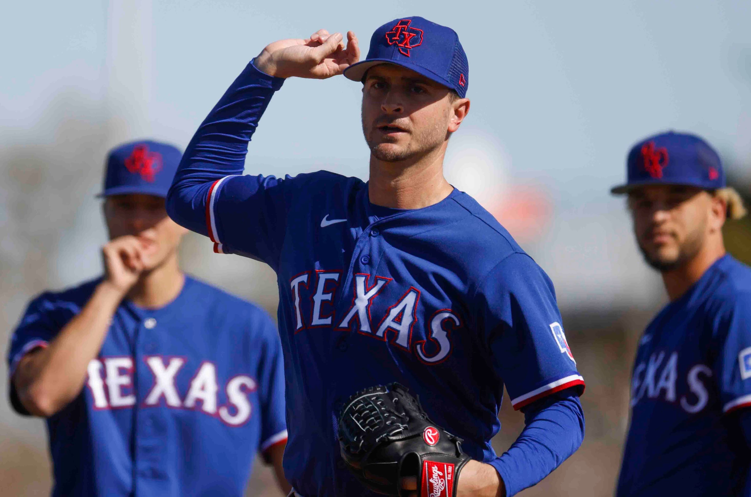 Texas Rangers right handed pitcher Jake Odorizzi practices during a spring training workout...